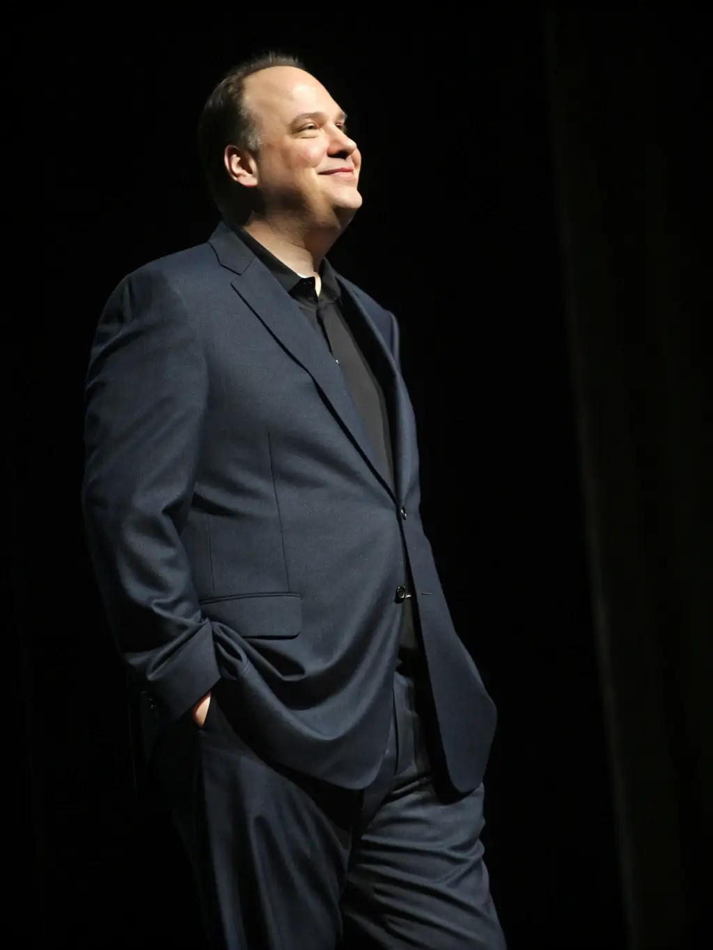 A person wearing a custom-tailored GFV suit, exuding confidence and style, emphasizing the brand's commitment to style as discipline.